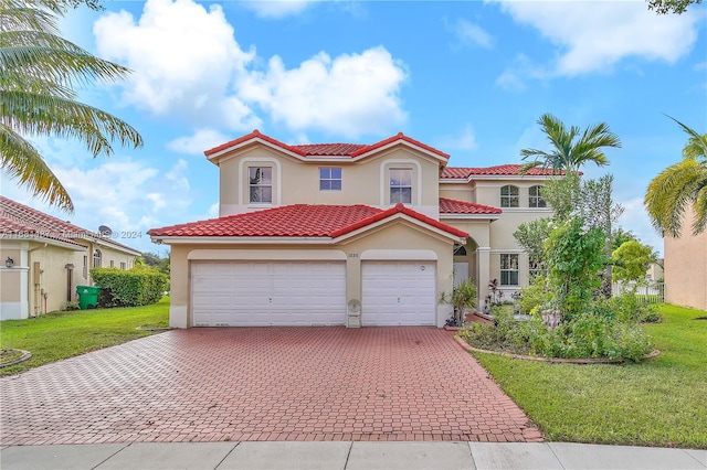 mediterranean / spanish-style home with a front lawn