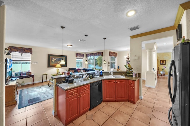 kitchen with ornate columns, black dishwasher, hanging light fixtures, sink, and stainless steel fridge