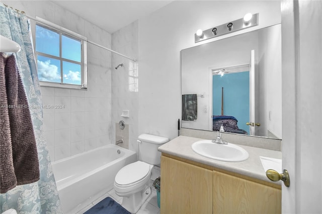 full bathroom featuring toilet, vanity, shower / bath combination with curtain, and tile patterned floors