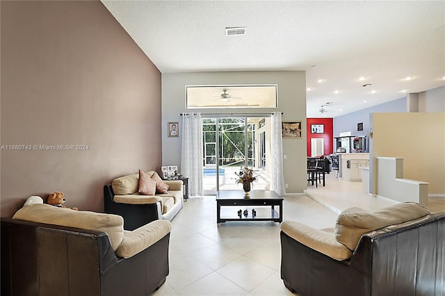 living room featuring vaulted ceiling and ceiling fan