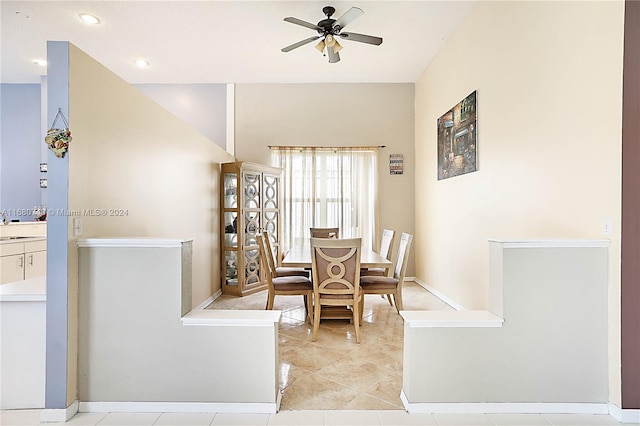 tiled dining room featuring ceiling fan