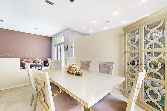 dining room featuring light tile patterned flooring