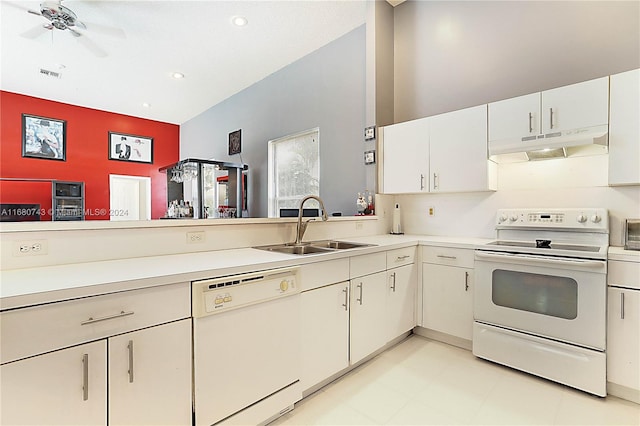 kitchen featuring ceiling fan, sink, white cabinets, and white appliances