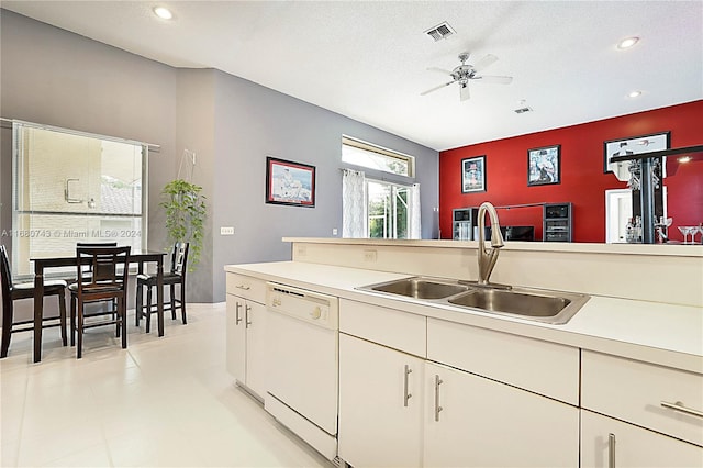 kitchen featuring ceiling fan, dishwasher, a textured ceiling, and sink