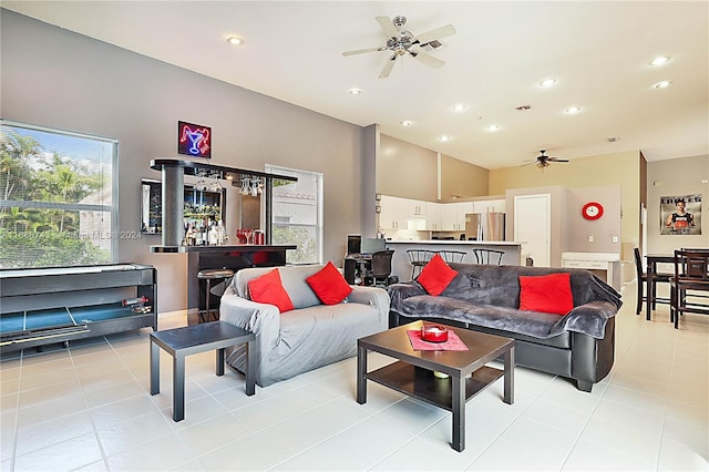 living room featuring light tile patterned floors and ceiling fan