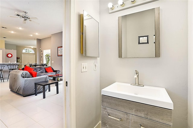 bathroom featuring tile patterned floors, ceiling fan, and vanity