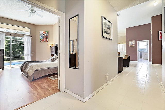 hall featuring light tile patterned floors