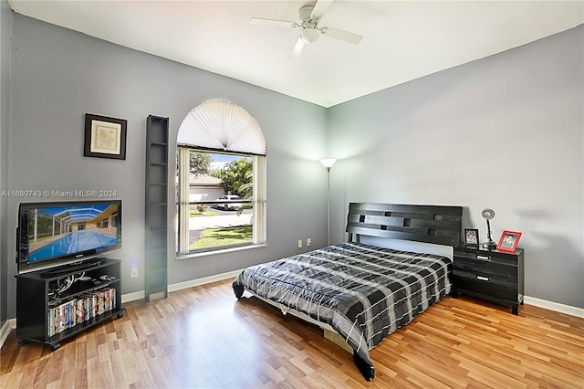 bedroom featuring hardwood / wood-style floors and ceiling fan