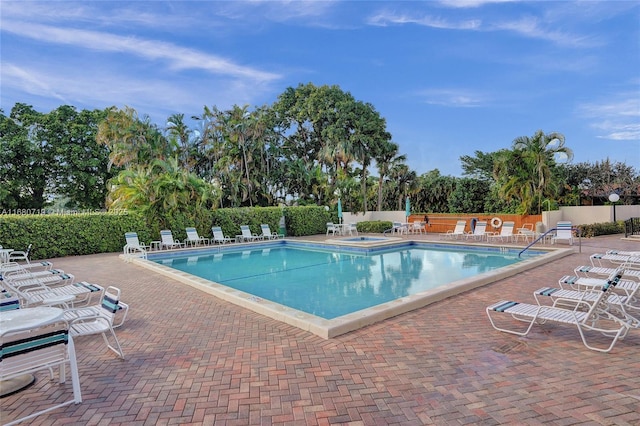 view of swimming pool with a patio area