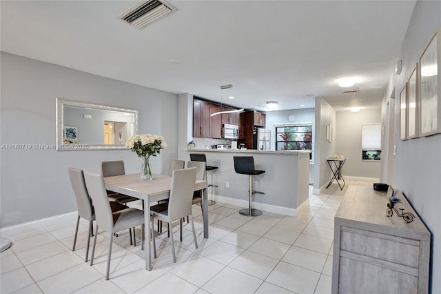 view of tiled dining space