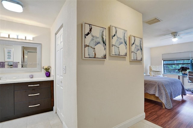 bathroom featuring vanity, tile patterned floors, and ceiling fan