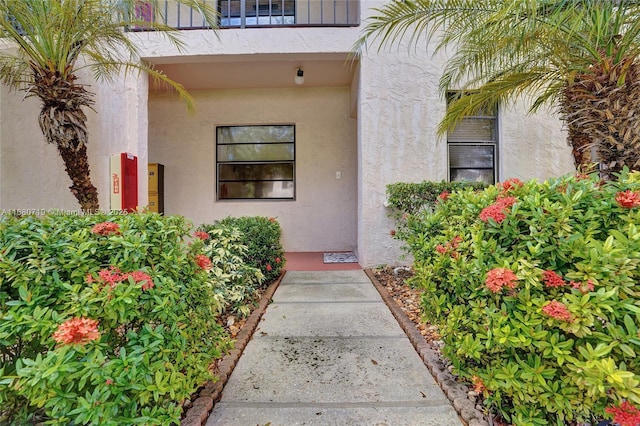 entrance to property with a balcony