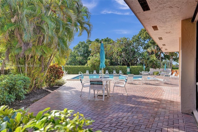 view of patio / terrace featuring a community pool