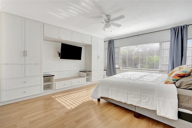 bedroom with ceiling fan and light wood-type flooring