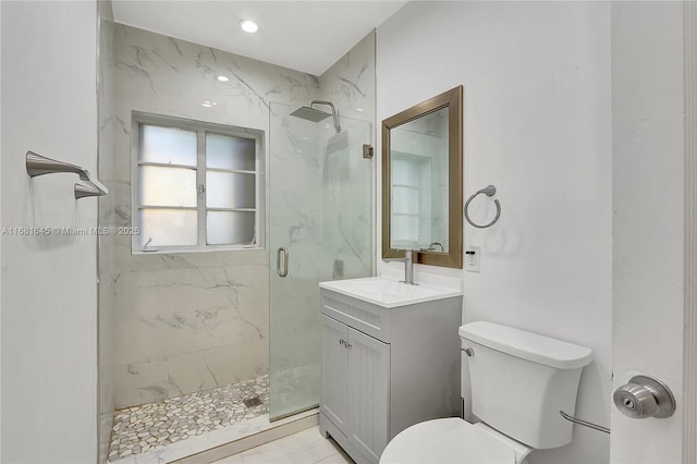 bathroom featuring walk in shower, vanity, and toilet