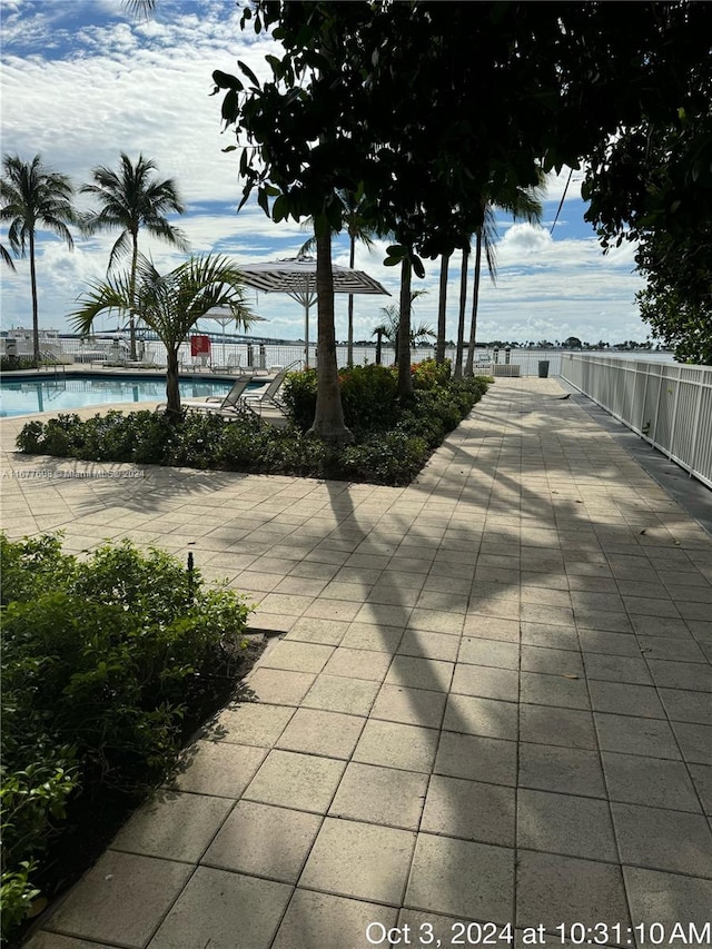 view of community featuring a patio area and a swimming pool