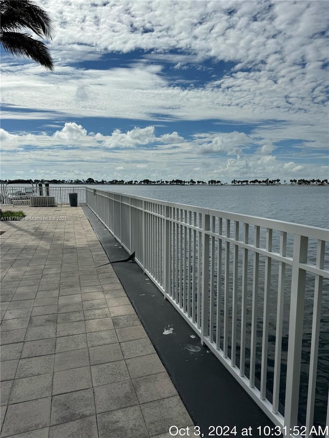 view of patio with a water view