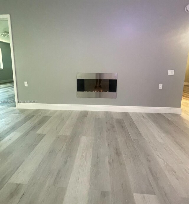 spare room featuring hardwood / wood-style floors