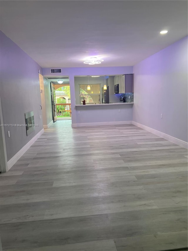 empty room featuring wood-type flooring