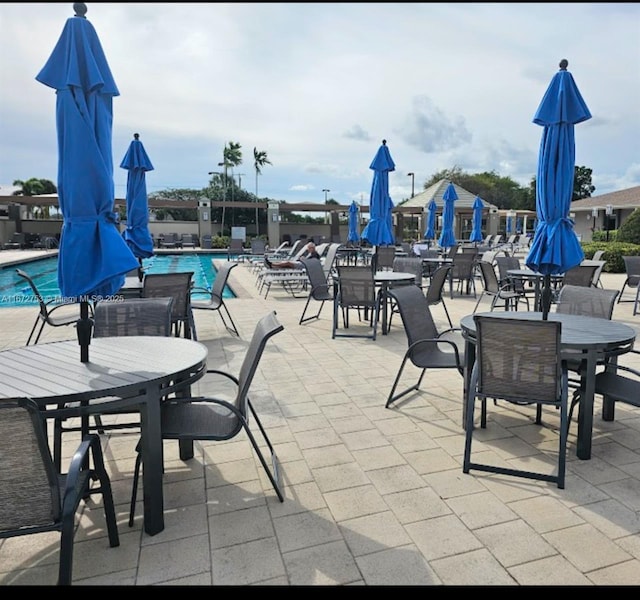 view of patio / terrace featuring a community pool