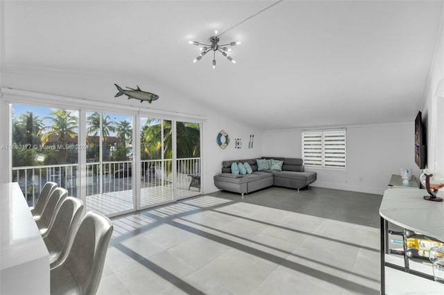 tiled living room with lofted ceiling and an inviting chandelier