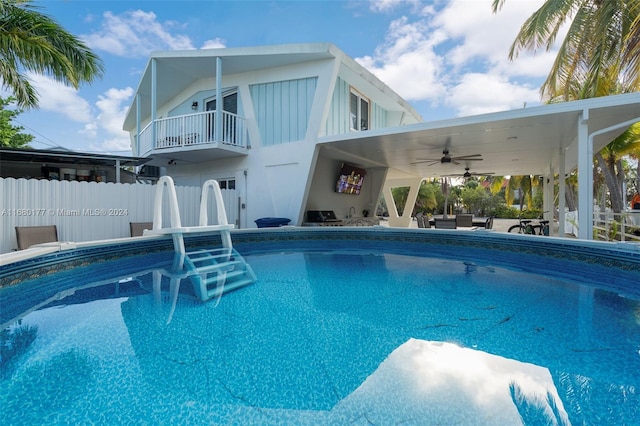 view of swimming pool with a patio, ceiling fan, and outdoor lounge area