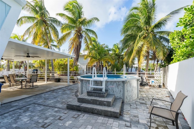 view of patio / terrace featuring ceiling fan