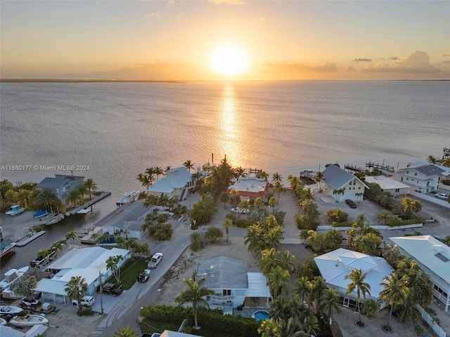 aerial view at dusk with a water view