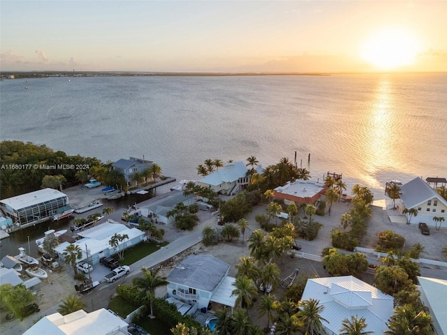 aerial view at dusk with a water view