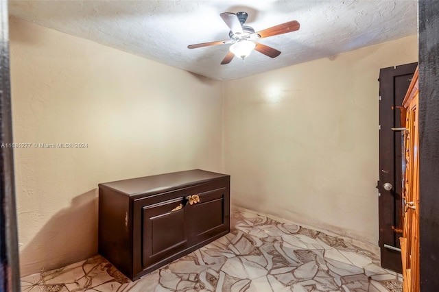 interior space with a textured ceiling