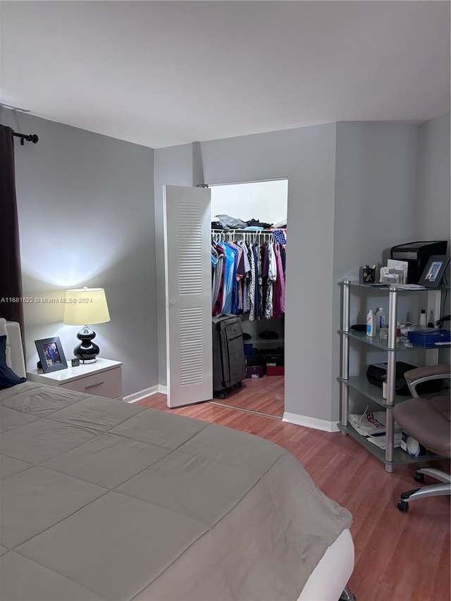 bedroom featuring hardwood / wood-style flooring and a closet