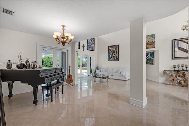 miscellaneous room with french doors and an inviting chandelier