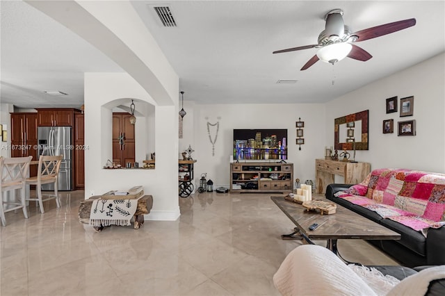 living room featuring ceiling fan