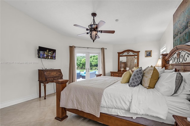 tiled bedroom featuring access to outside, french doors, and ceiling fan