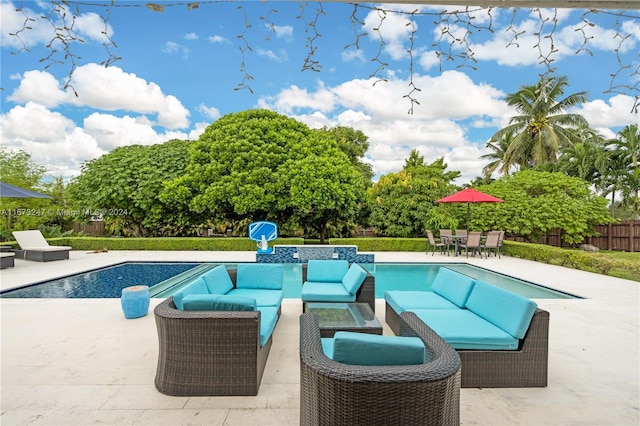 view of pool featuring a patio area and outdoor lounge area