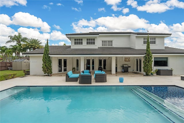 back of house featuring a patio area and an outdoor hangout area