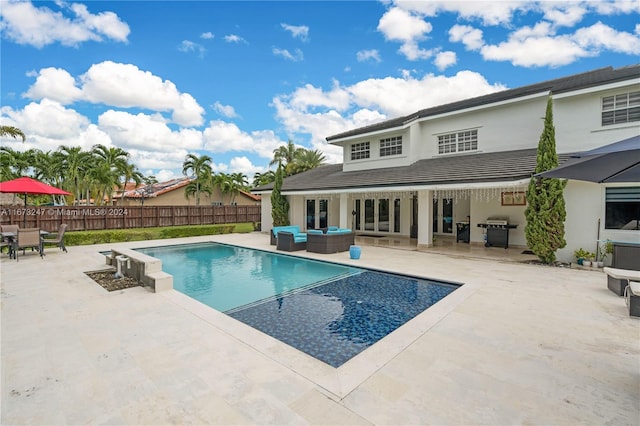 view of pool featuring a patio area and grilling area