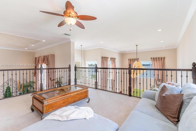 living room with a wealth of natural light, crown molding, and light colored carpet