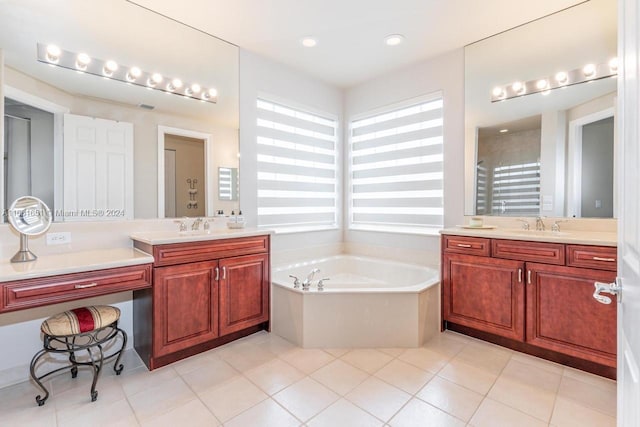 bathroom with vanity, tile patterned flooring, and plus walk in shower