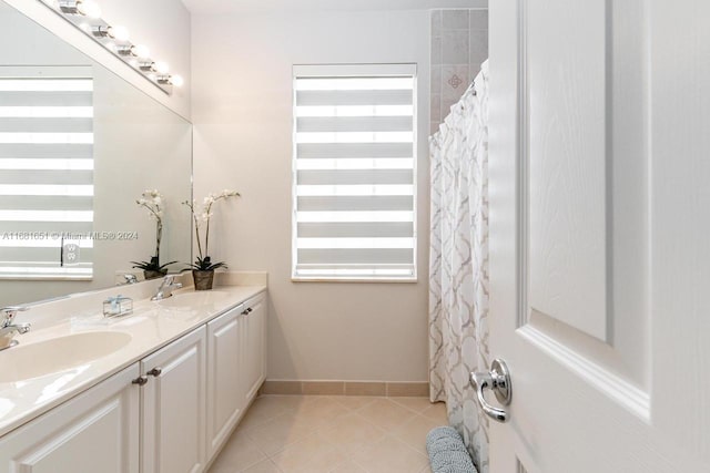 bathroom featuring vanity, walk in shower, and tile patterned flooring