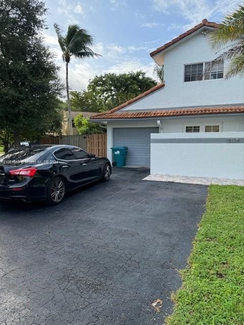 view of property exterior featuring a garage