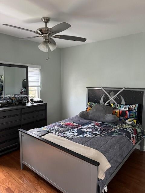 bedroom with wood-type flooring and ceiling fan