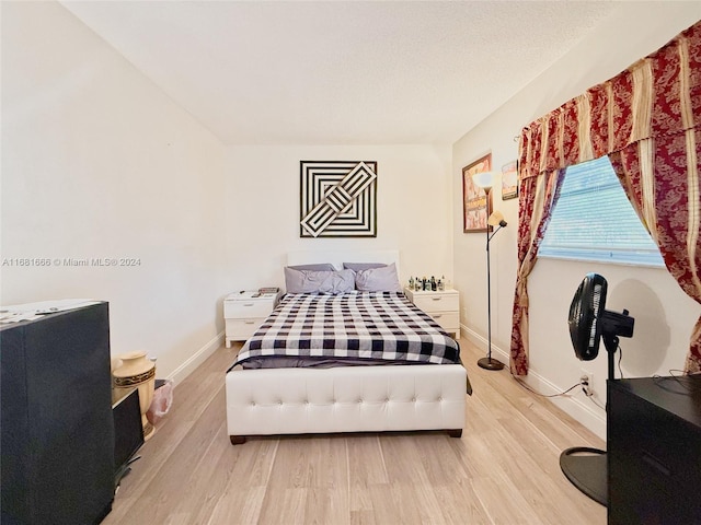 bedroom featuring light wood-type flooring