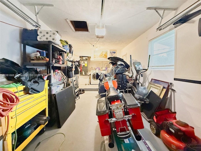 garage with washer and clothes dryer