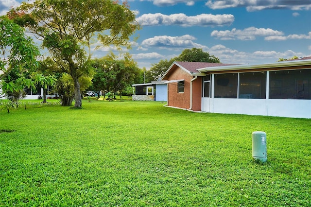 view of yard with a sunroom