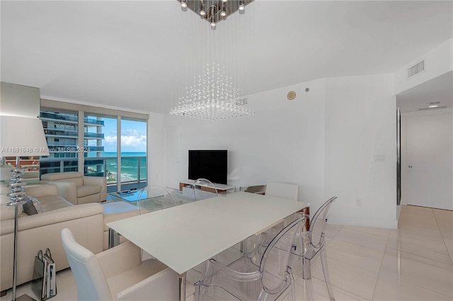 dining room with expansive windows, a chandelier, and light tile patterned flooring