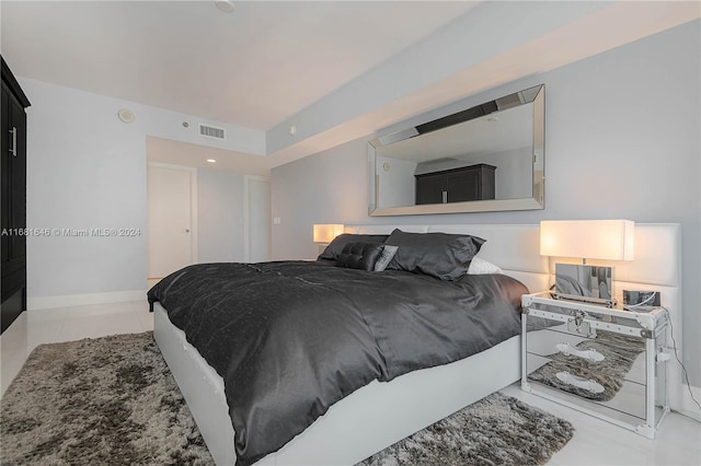 bedroom featuring light tile patterned flooring