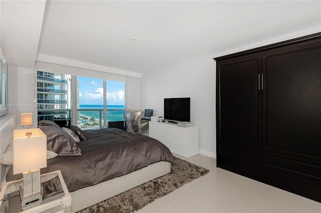 bedroom with light tile patterned floors