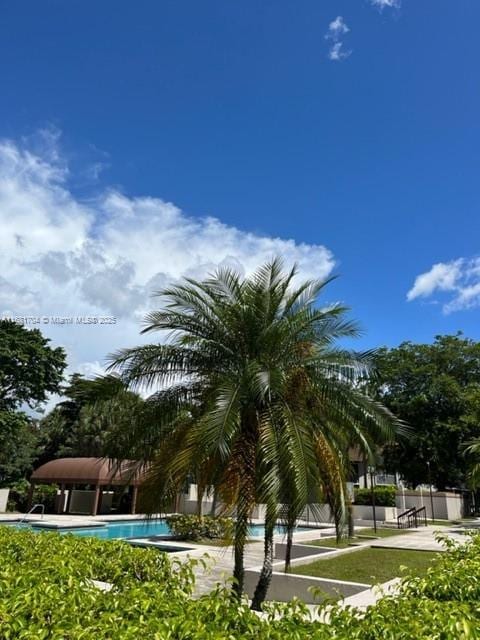 view of property's community featuring a pool