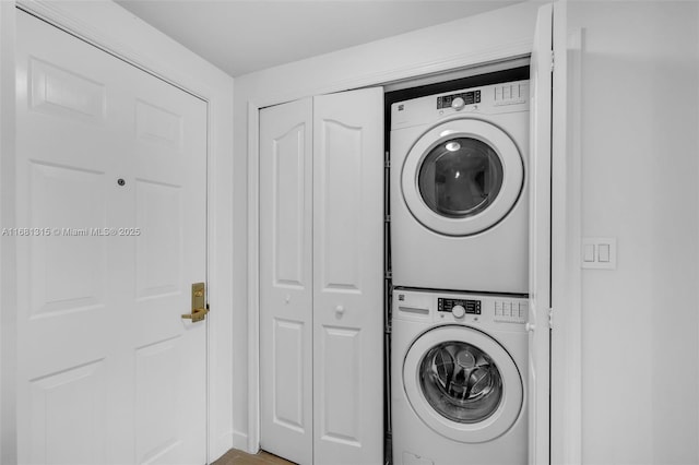 laundry area featuring laundry area and stacked washer / drying machine